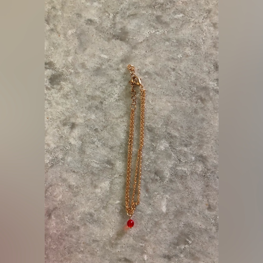 Elegant Gold Chain Bracelet with red bead
